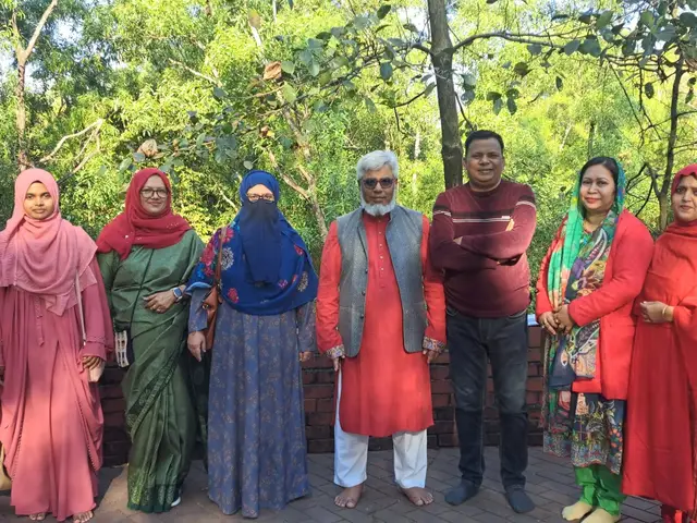 Group photo from an outdoor alumni community gathering.