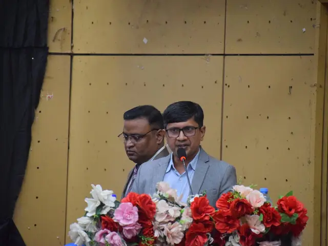 Speaker presenting at the seminar hall.