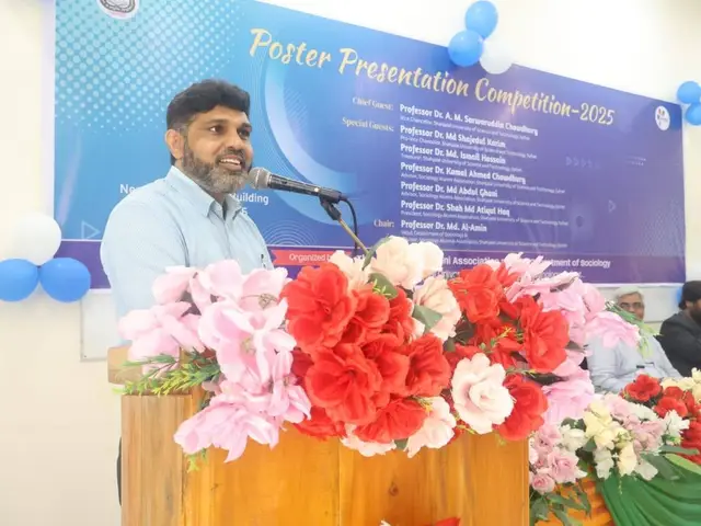 Host addressing the audience at the competition program.