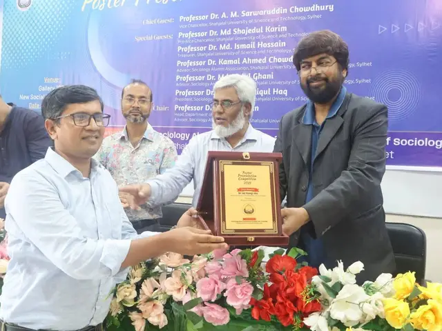 Certificate and crest handover during the academic event.