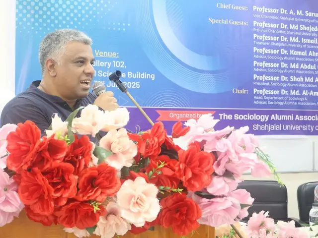 An alumni association representative speaking at the program.